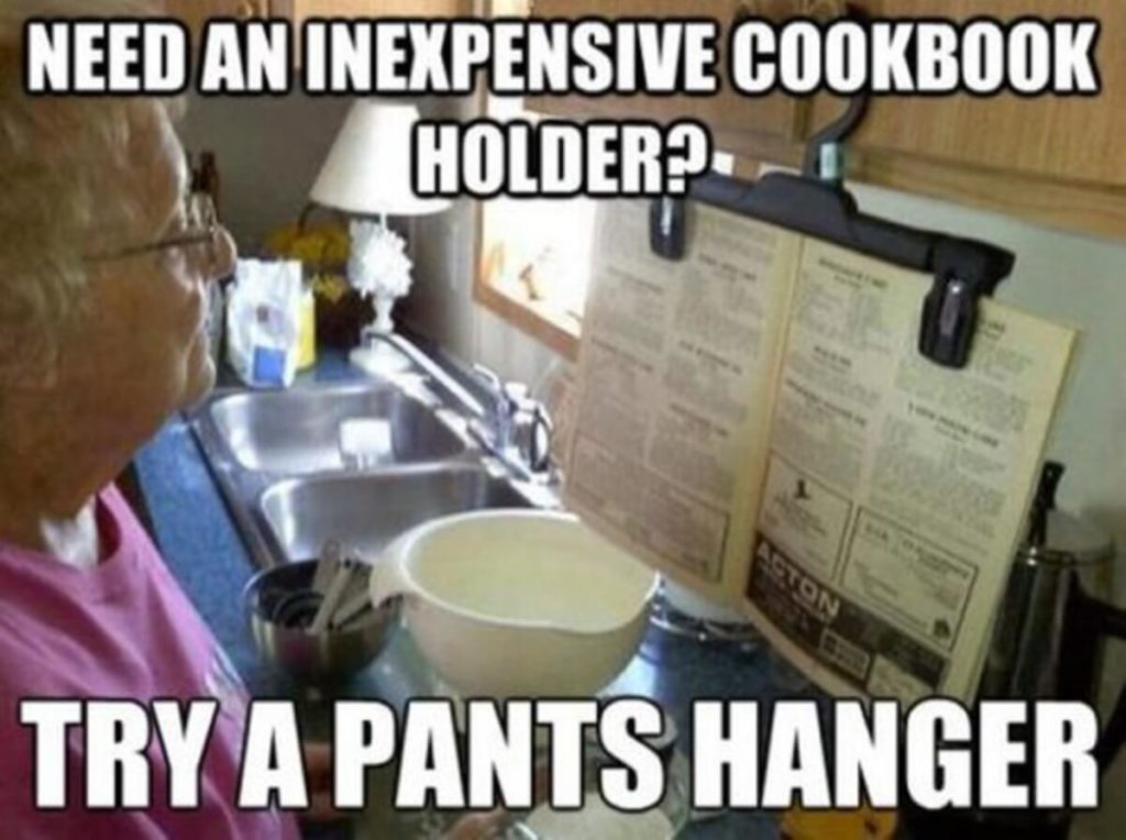 Use a pants hanger as an inexpensive cookbook holder