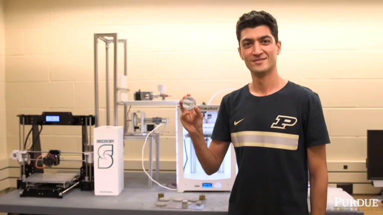 Mohamadreza "Reza" Moini with his 3D printers and a 3D printed cement design