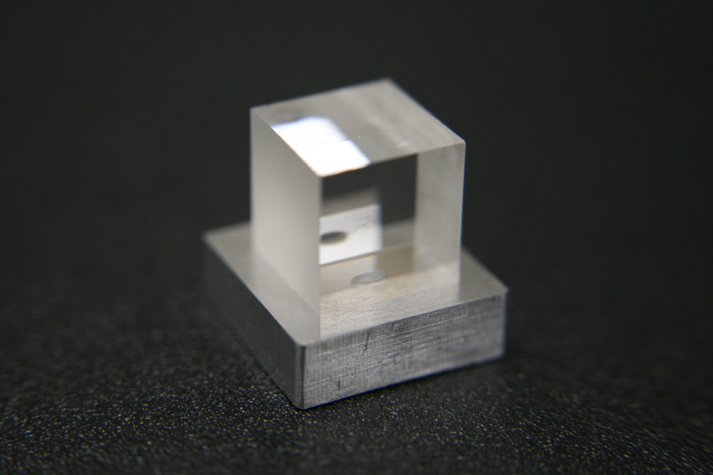 Glass welded to metal