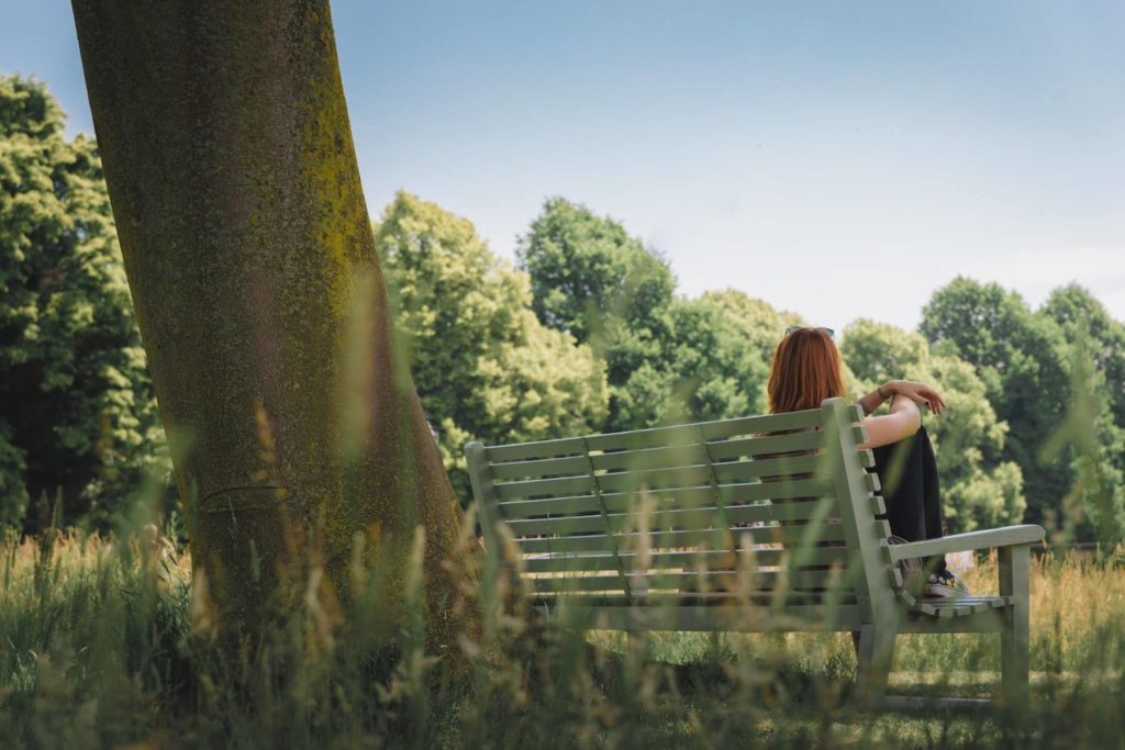 Relaxing in nature by a tree