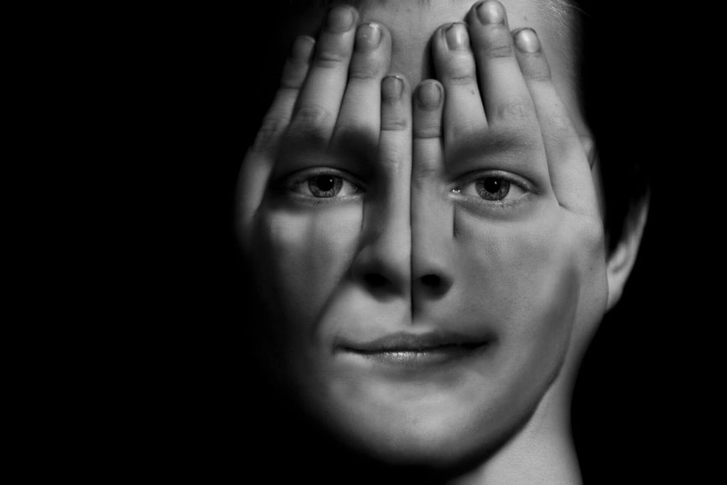 The boys face in the hands