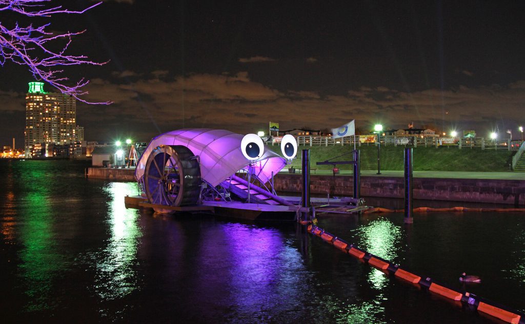 Mr. Trash wheel glowing at night
