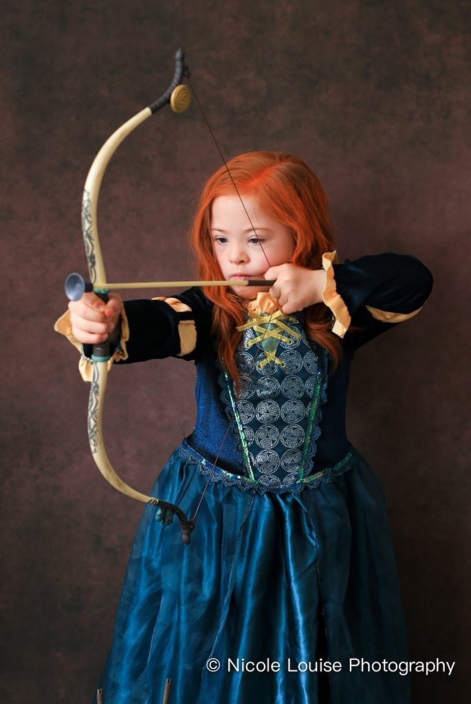 children with Down Syndrome posing as Disney characters for an awareness campaign 