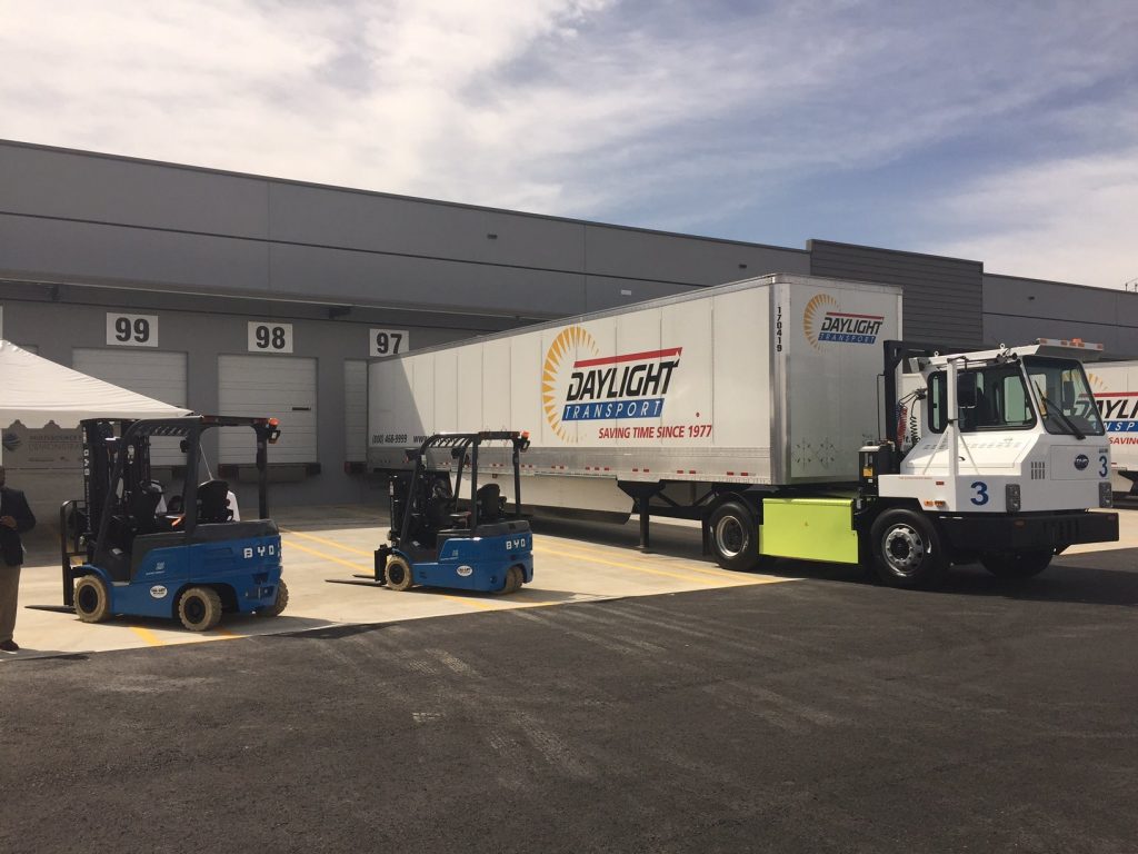 BYD electric forklift operating outside a warehouse