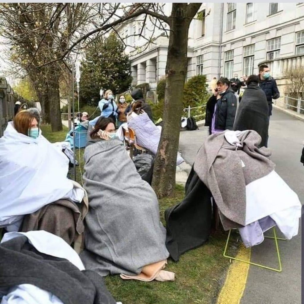 Mothers outside evacuated maternity hospital
