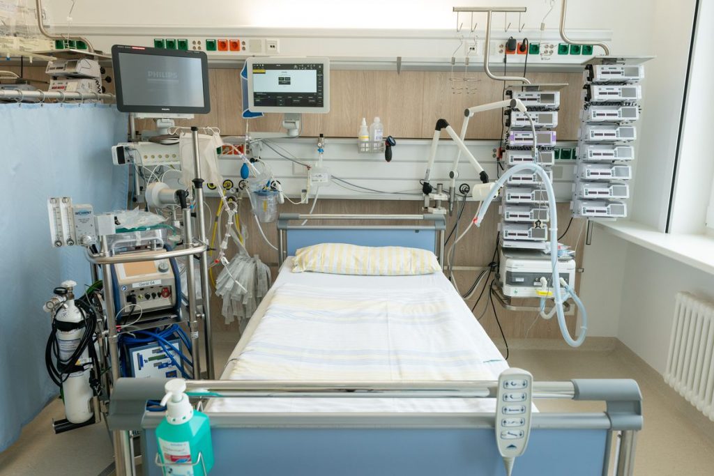 Hospital bed with a ventilator machine.