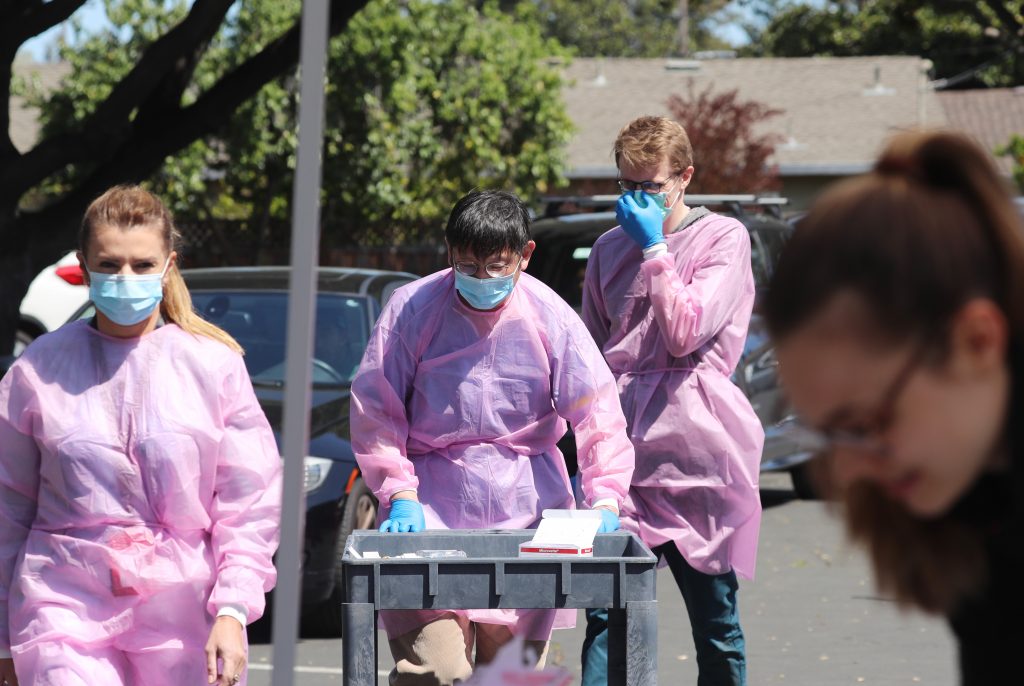 Researchers preparing to test individuals for the SARS-CoV-2 virus