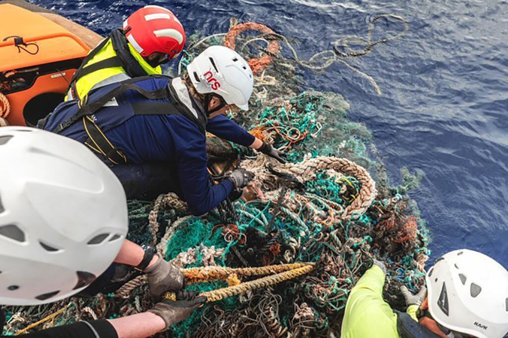The Ocean Cleanup team collecting plastic from the water