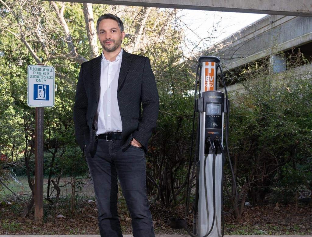 Gleb Yushin, a Georgia Tech Professor, at a campus EV charging station.