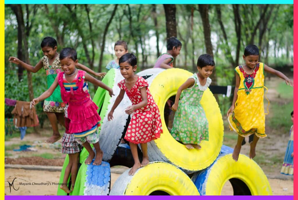 Children playing on a structure made of recycled tires built by Anthill Creations in Janakpur, Nepal