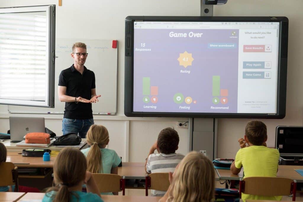teacher teaching pupils at school