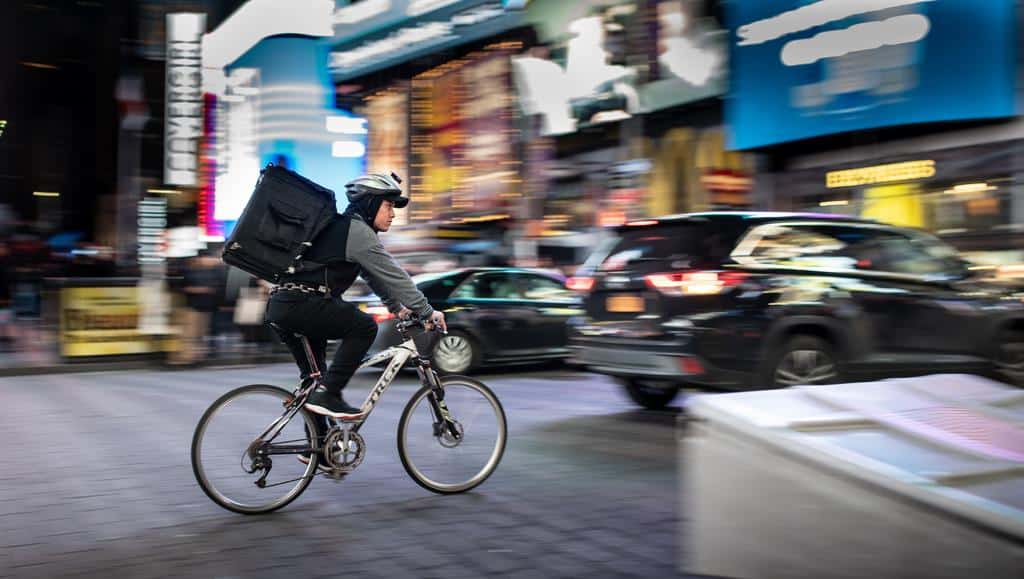 cyclist food delivery at night