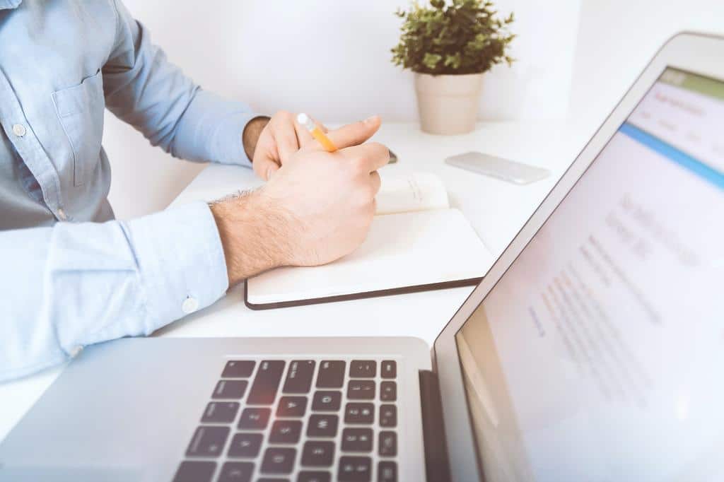 person performing business work at the office