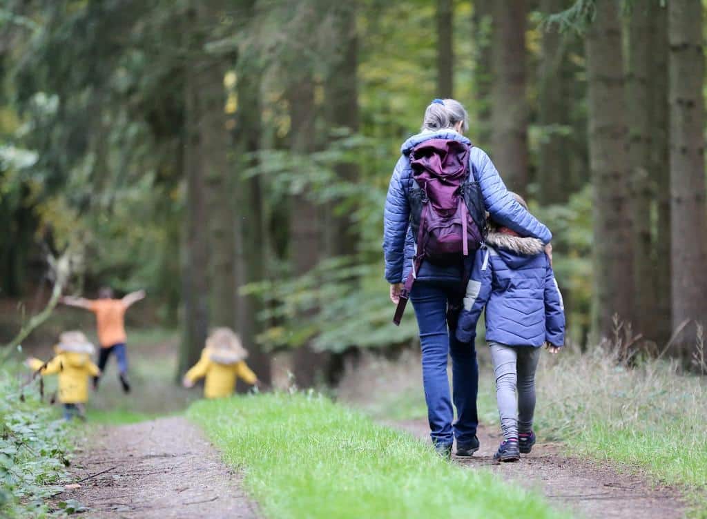 family walking through a nature trail