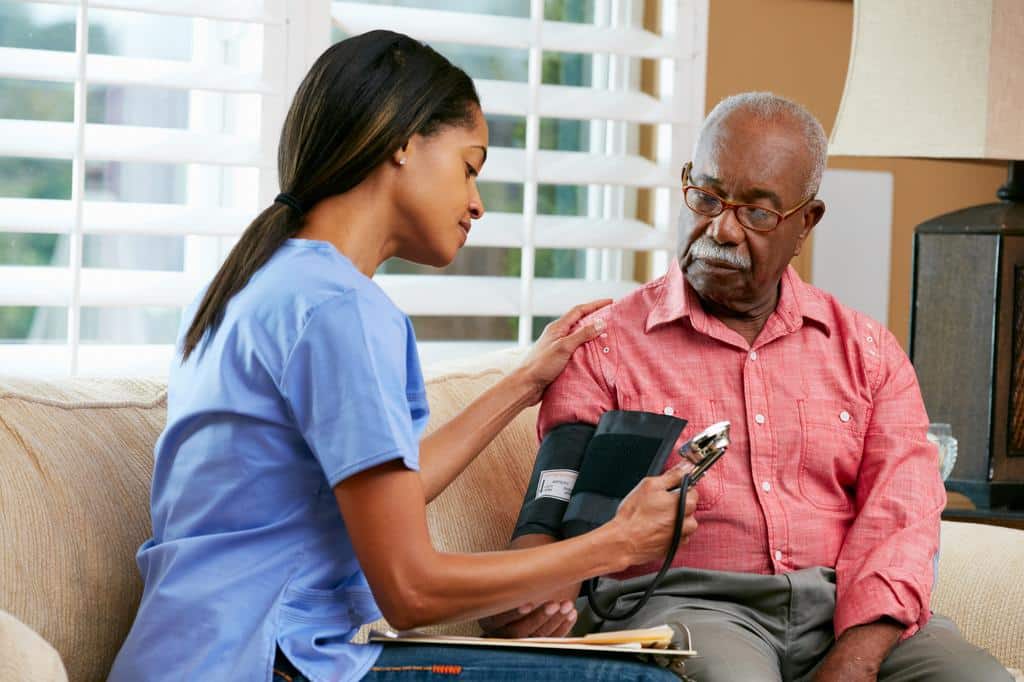 nurse checking patient vitals