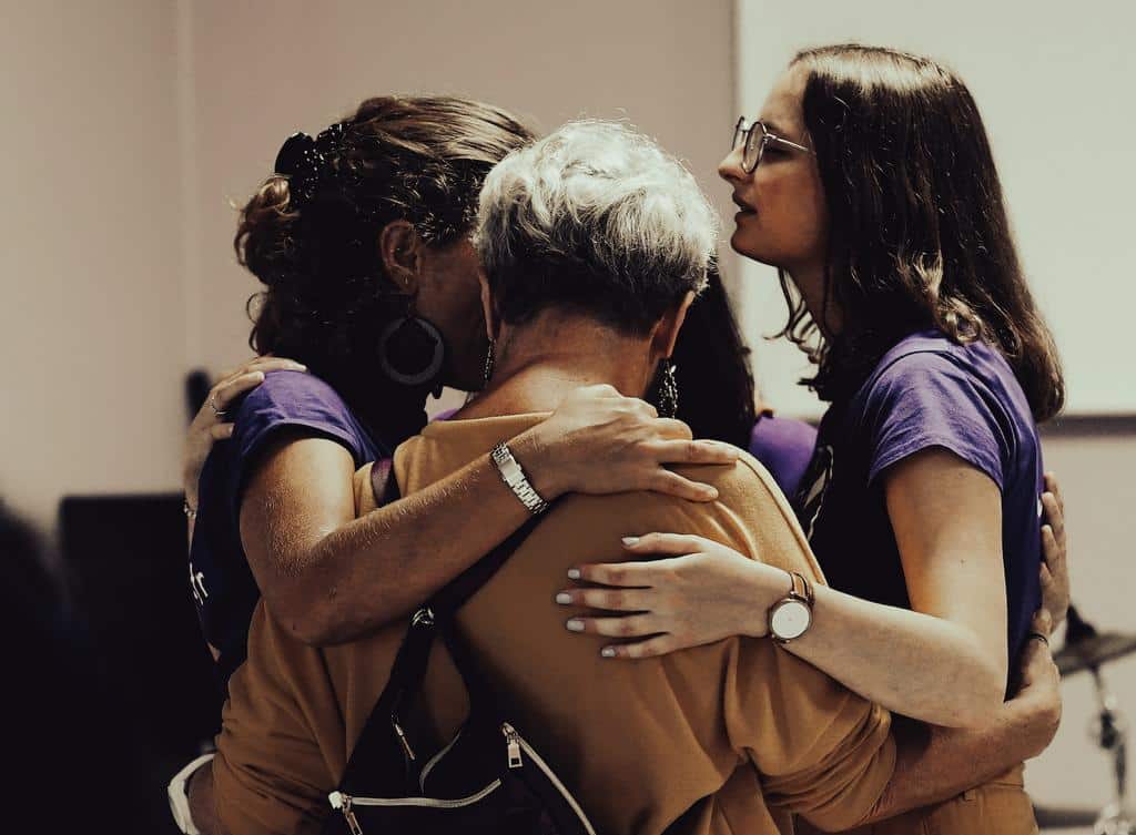 women consoling