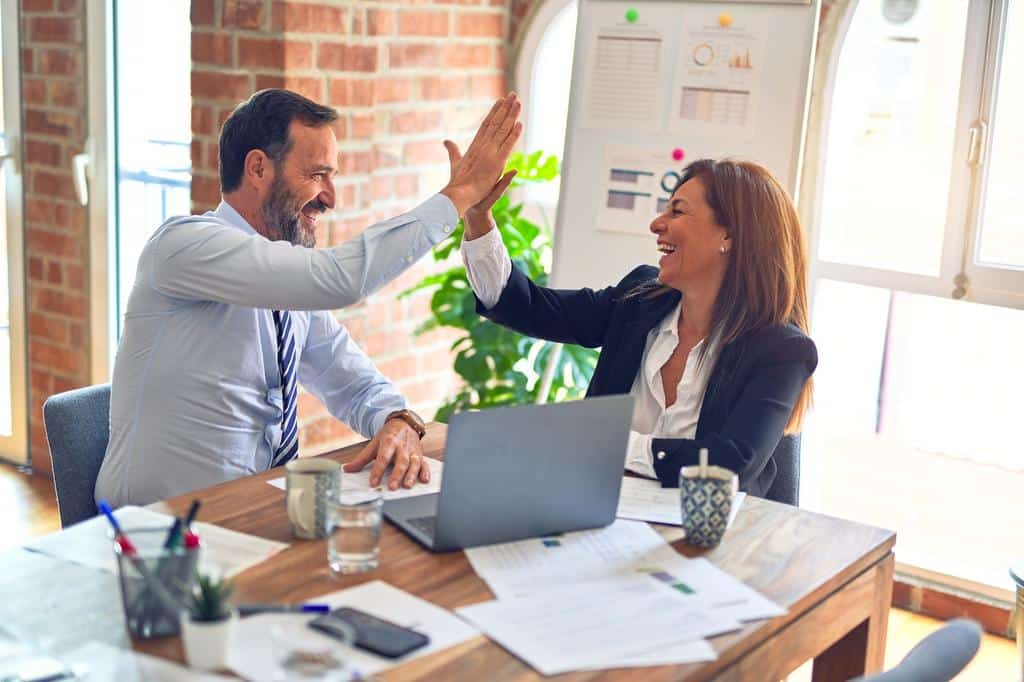 two people engaging in a high five
