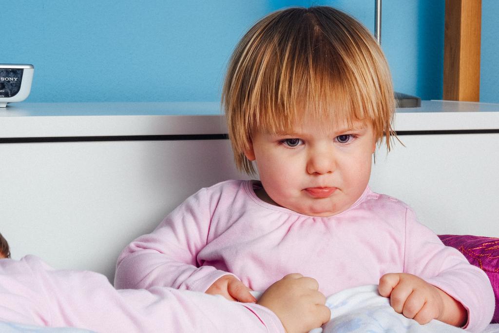 toddler girl in pink soft fabrics