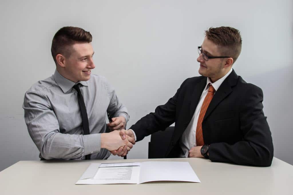 business persons shaking hands