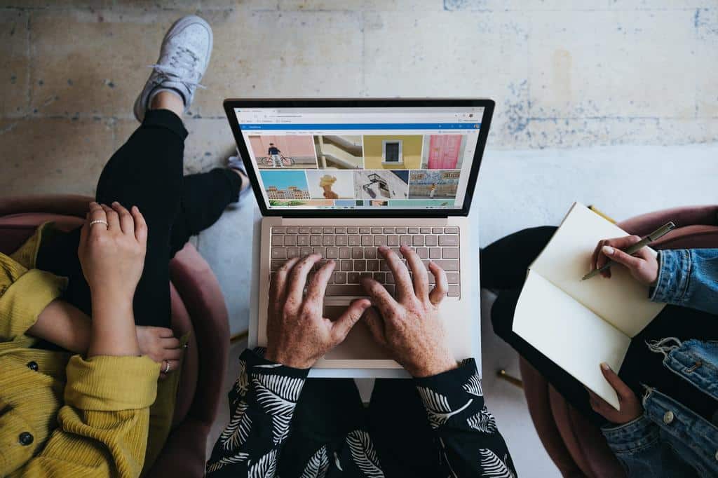 people performing marketing on a laptop