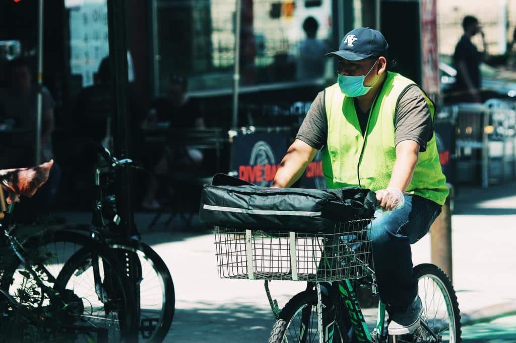 man delivering food on a bicycle