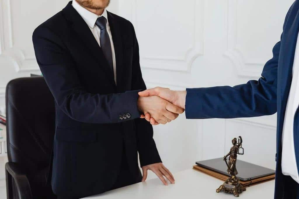 lawyer shaking hand of client