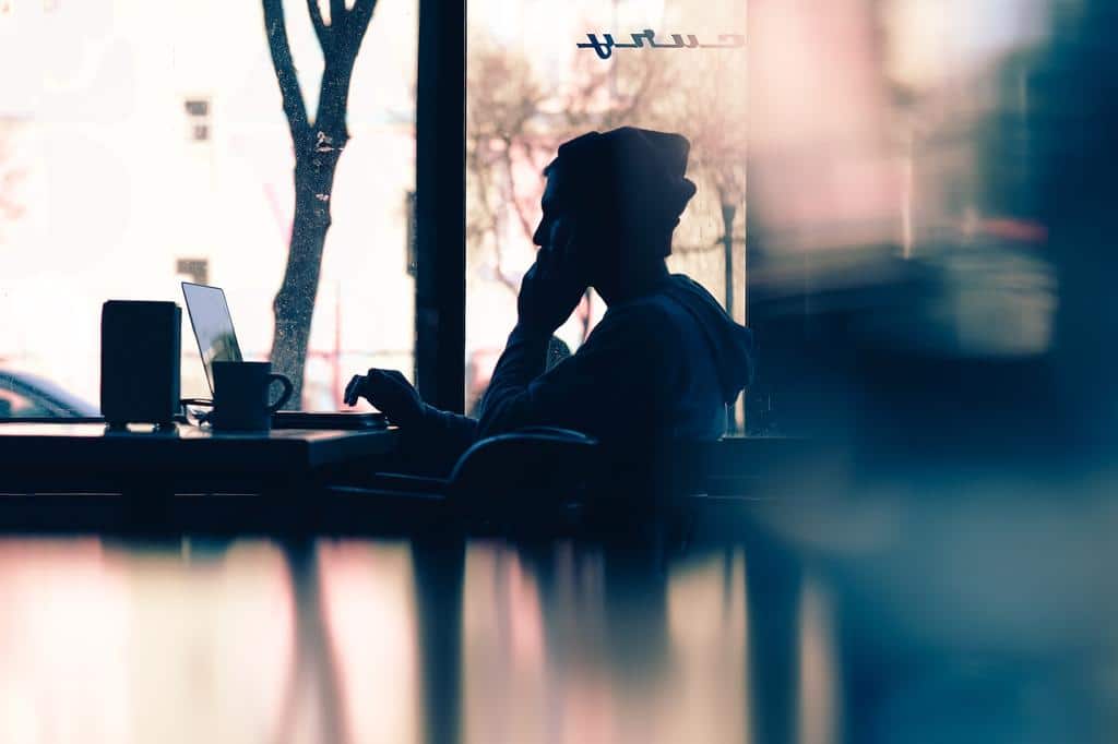 silhouette of person on phone