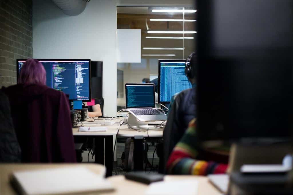 people working in office working on SaaS