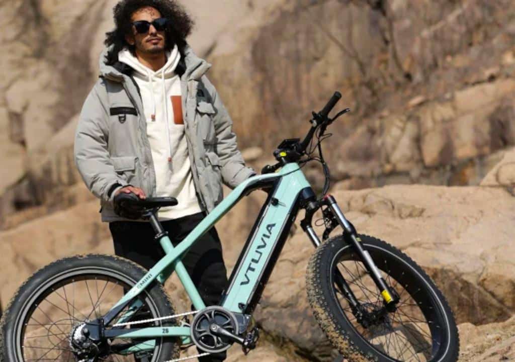 person holding Vtuvia electric mountain bike
