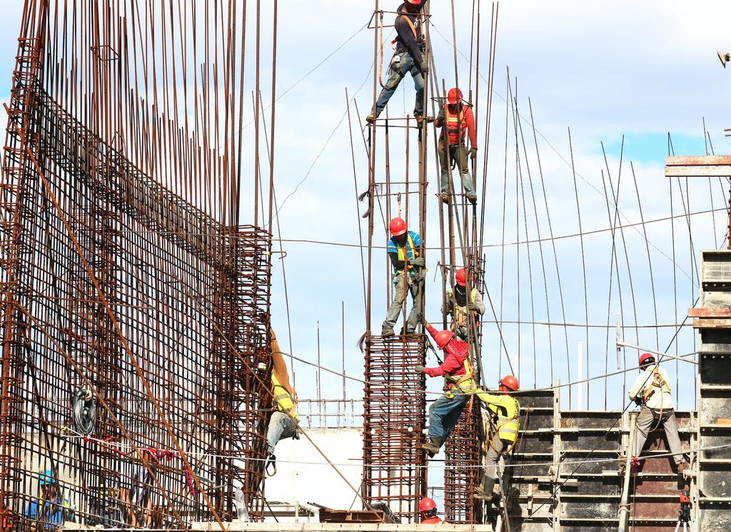 workers building concrete pillar forms