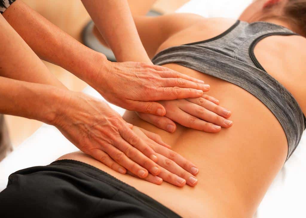 two people providing massage