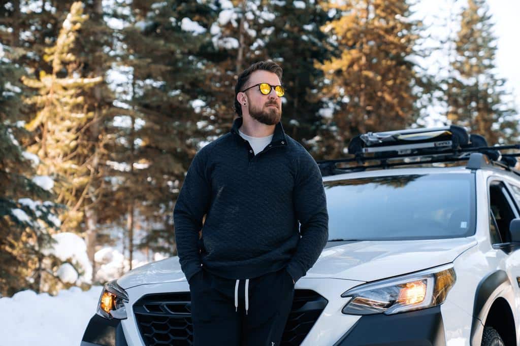 man standing by car