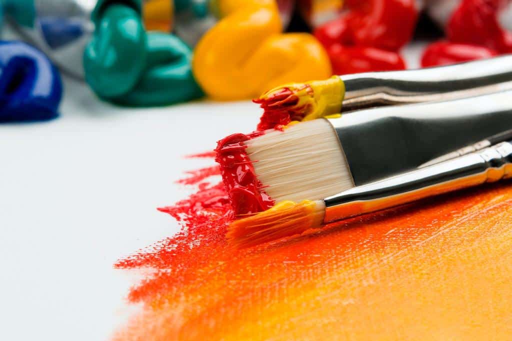 paint brushes covered in paint