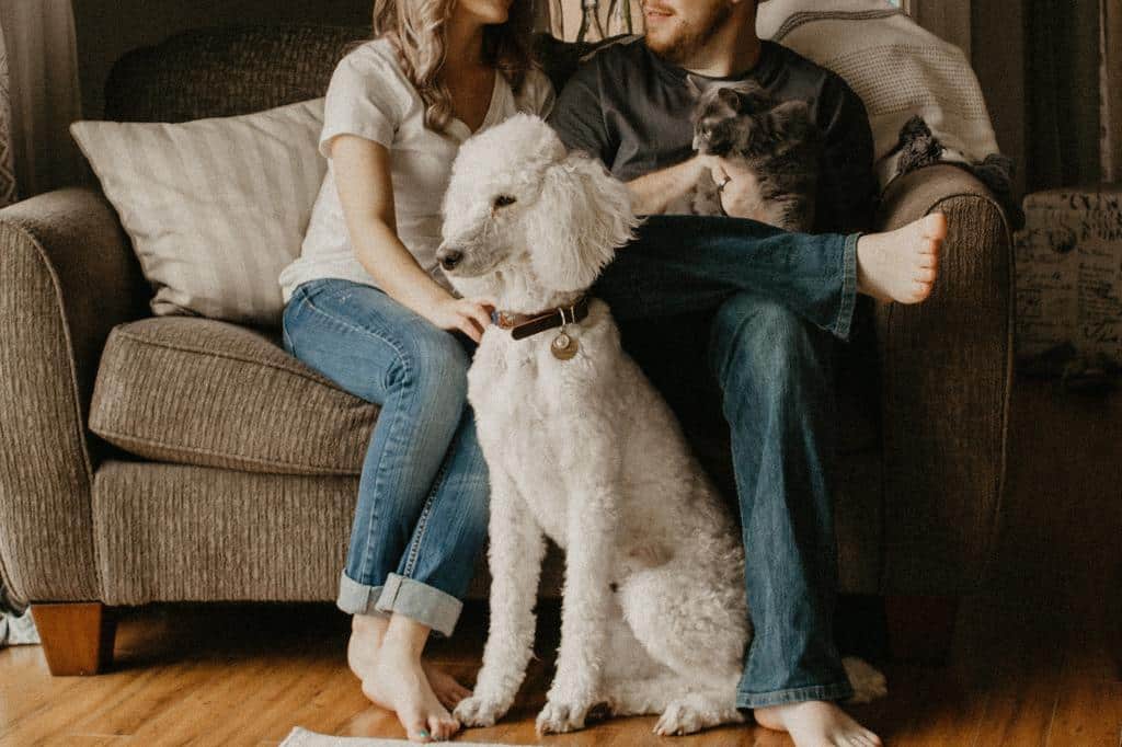 couple with dog at home