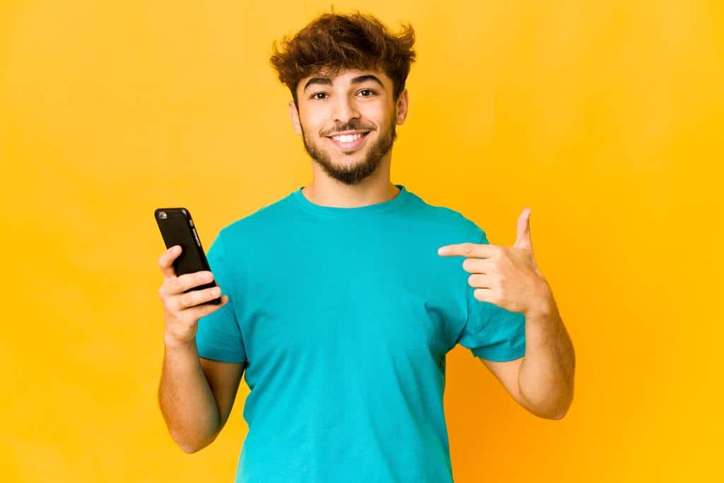 happy person holding a smartphone
