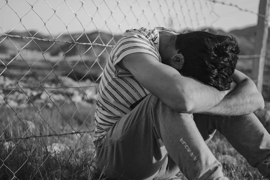 young man sitting depressed