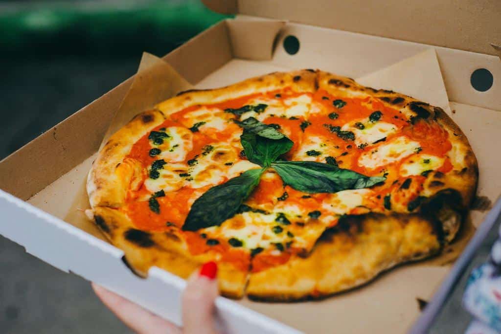 homemade pizza in delivery box