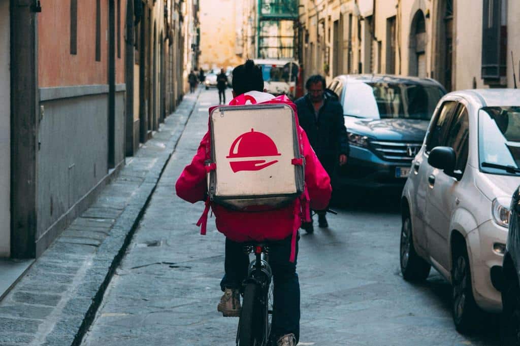 food delivery person on bicycle