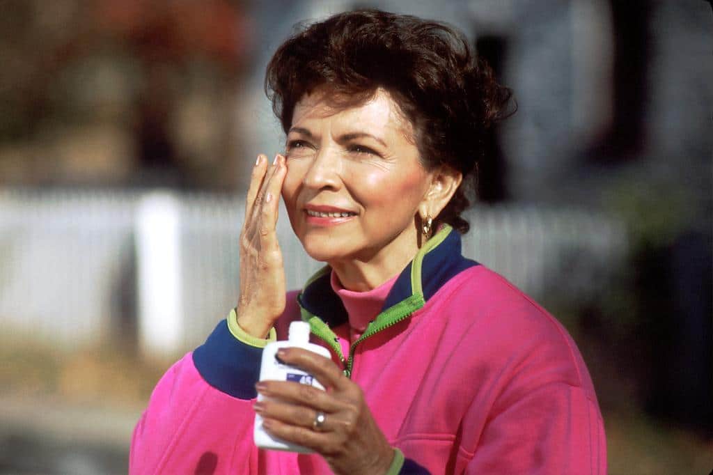 woman protecting and moisturizing skin