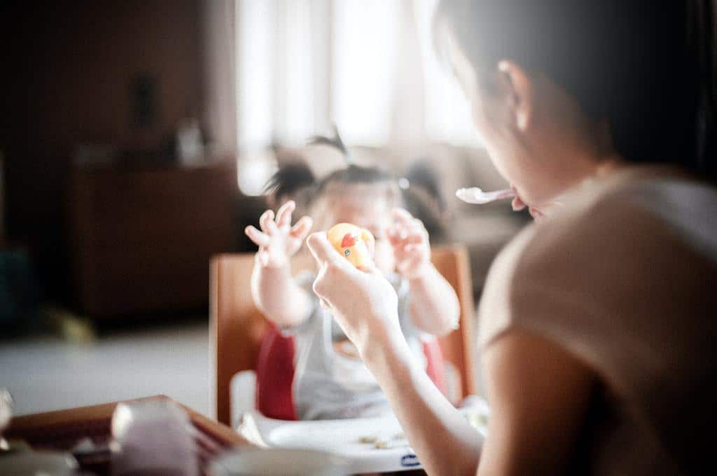 mother feeding infant