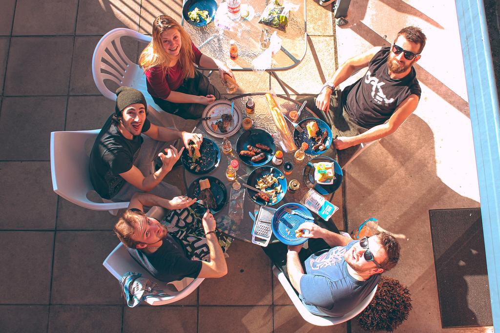 people eating at an outdoor grill event
