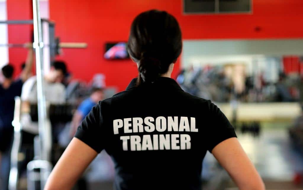 person wearing personal trainer shirt