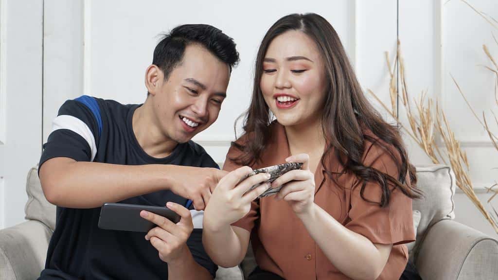 two people looking at online social content on phone