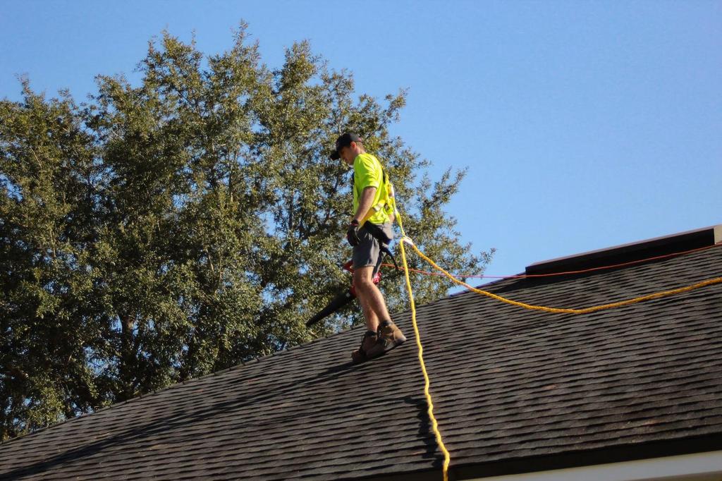 person inspecting roof