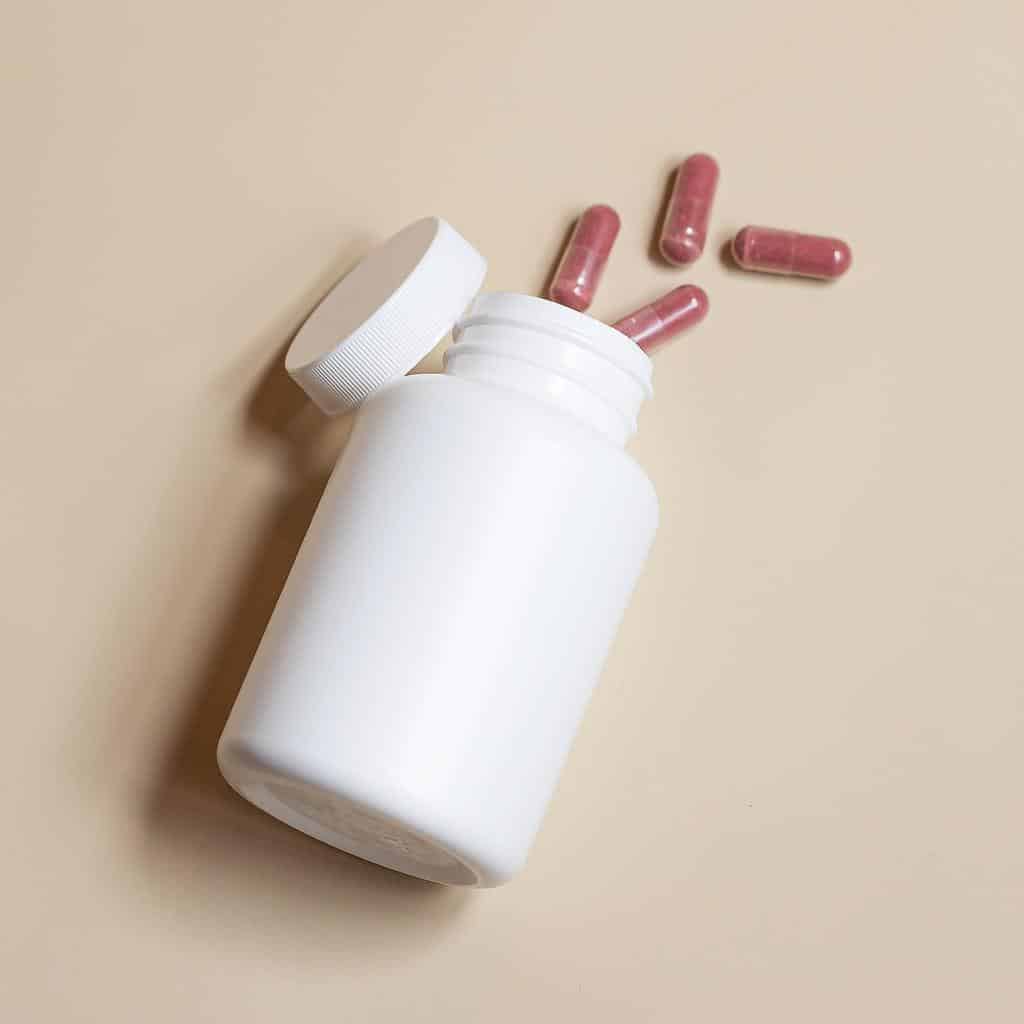 supplement bottle and pills