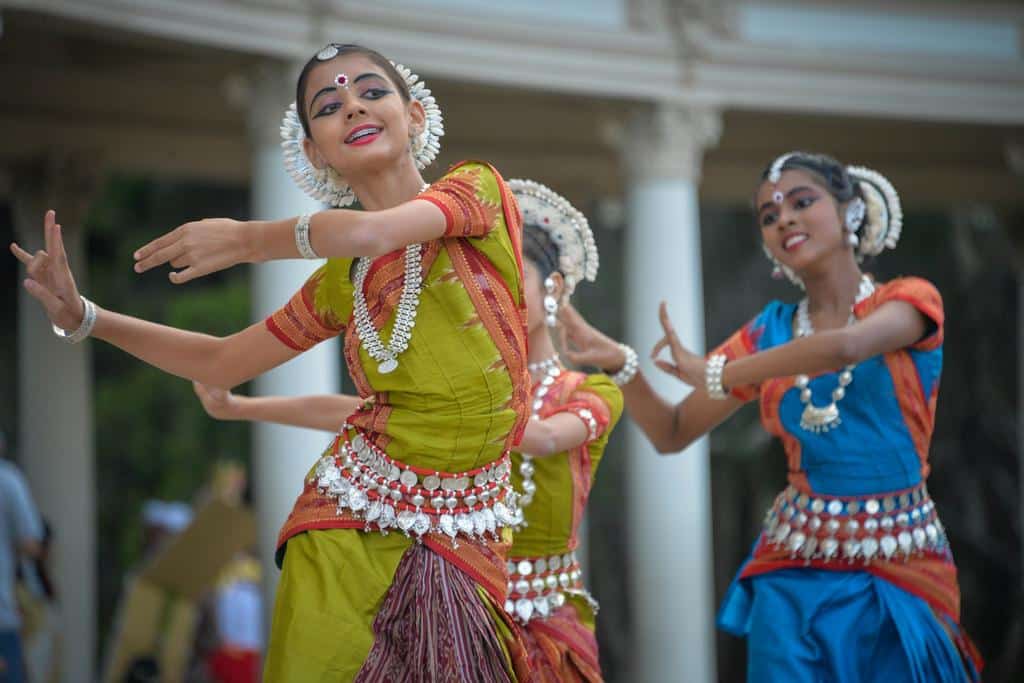 young women dance in cultural dress in India
