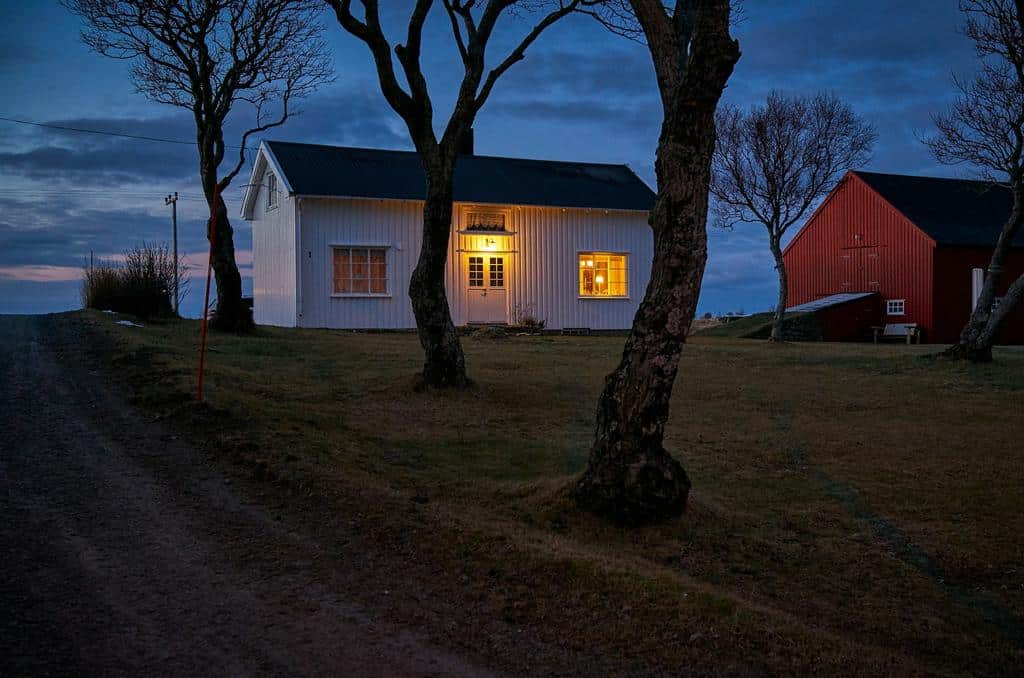 country home with an outdoor light