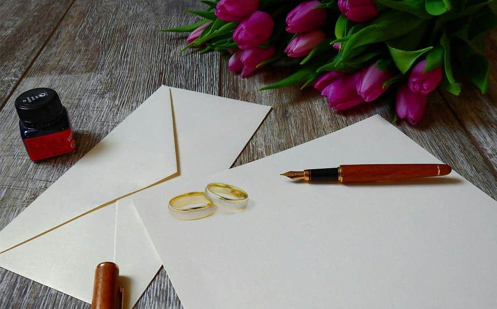 Wedding invitation and rings