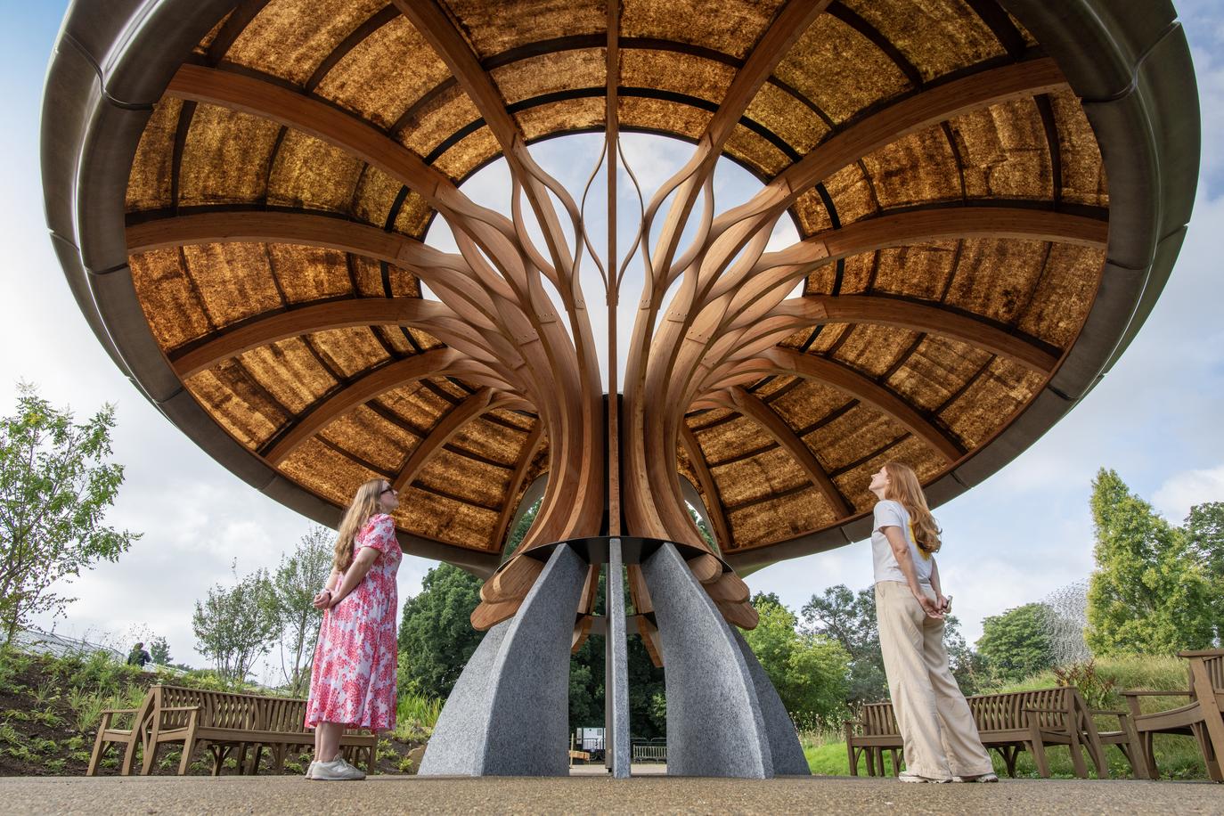 At the heart of the garden lies a striking architectural centrepiece: a canopy pavilion inspired by the branching networks of fungi.