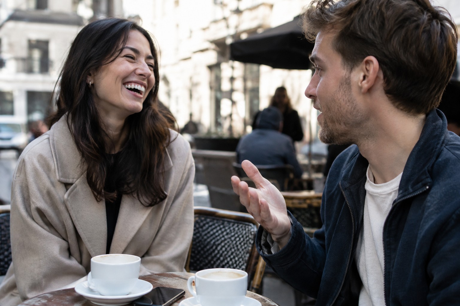 Photorealistic image of two colleagues at a cafe, generated by GPT Image 2.5 Flare at medium quality